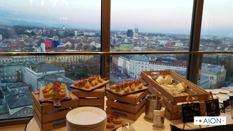 Buffet table at a conference in foreground with the view of Zagreb in the background